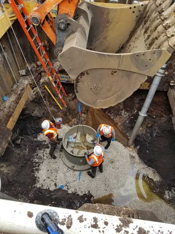Crews Setting the Manhole Base